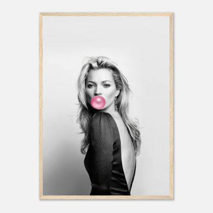 Black-and-white portrait of a woman with bubblegum, framed in a modern style, adding elegance and playfulness to decor.