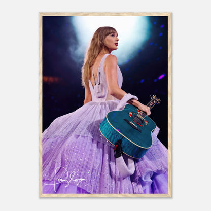 Taylor Swift framed poster in lavender gown holding a teal guitar, capturing her iconic stage presence. Ideal for fans.