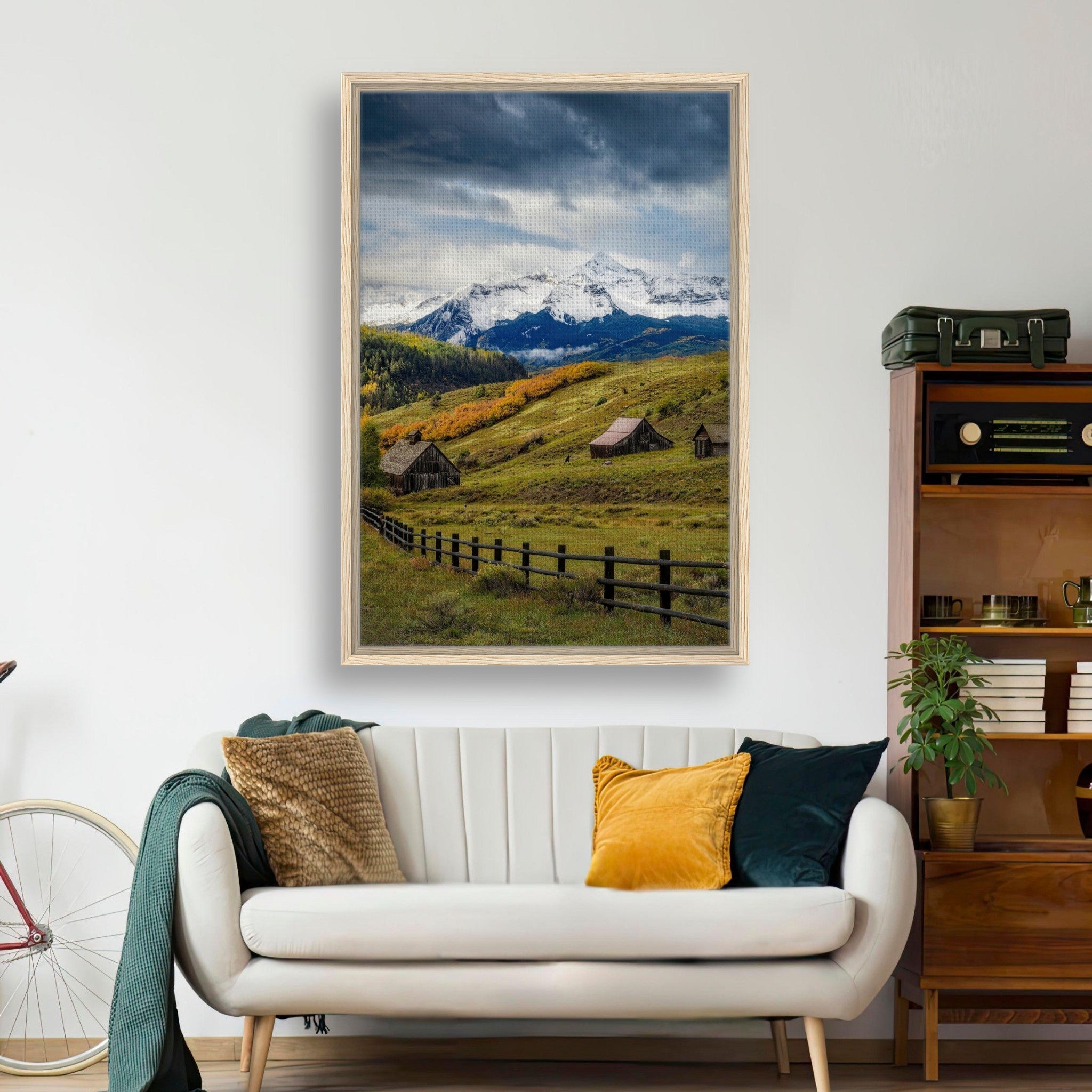 Framed canvas print of Telluride, Colorado showcasing snow-capped mountains and rustic barns in a serene valley setting.