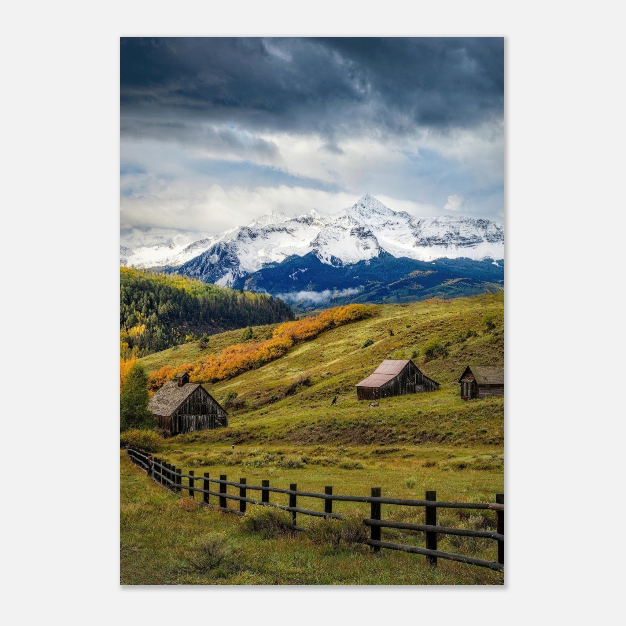 Majestic Telluride, Colorado metal print showcasing snow-capped mountains and rustic barns amidst autumn foliage.