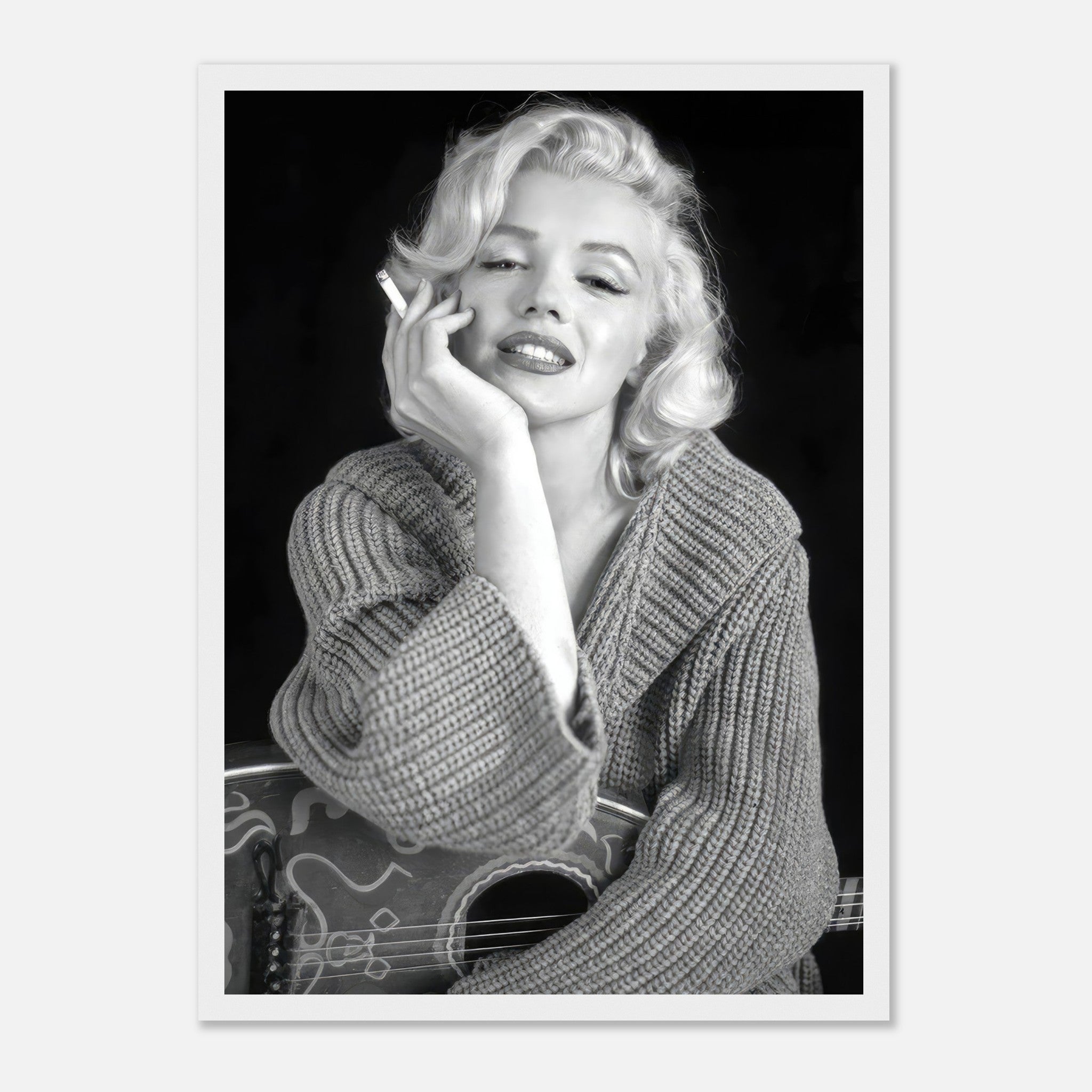 Marilyn Monroe smoking in a cozy sweater, iconic black-and-white framed poster capturing timeless Hollywood elegance.