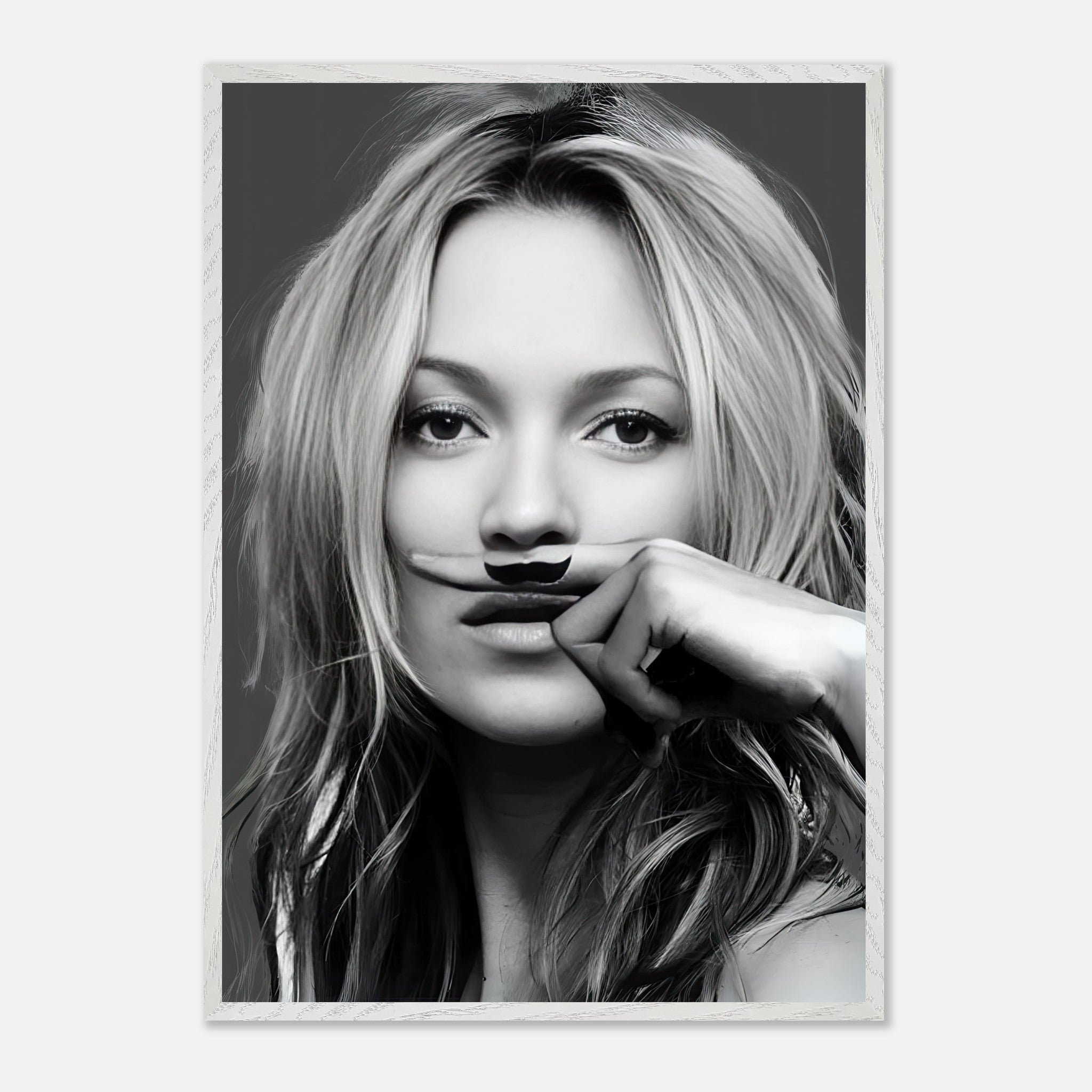 Kate Moss vintage framed print featuring a playful mustache, blending high fashion and humor in black-and-white art.