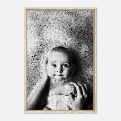 Framed canvas print of a serene baby smiling in bubbles, showcasing innocence and joy during bath time.