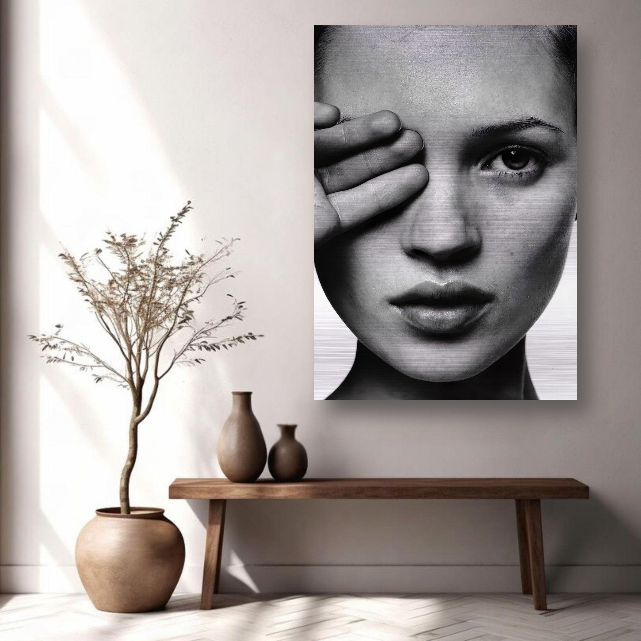 Kate Moss black and white portrait on brushed metal, enhancing minimalist decor in a modern living space.