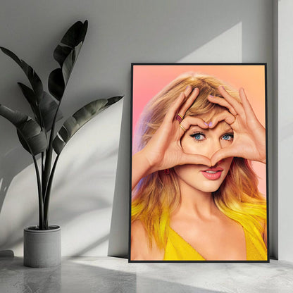 Taylor Swift framed print featuring vibrant colors and her making a heart gesture with hands in a stylish interior setting.