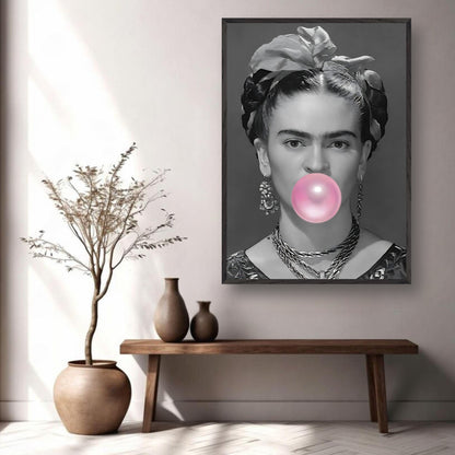 Frida Kahlo vintage framed art blowing bubble gum in monochrome with pink bubble, showcased in modern decor setting.