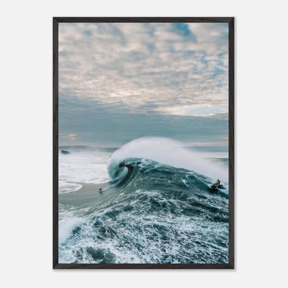 Big wave surfing fine art print capturing a surfer riding a colossal wave against a moody sky.
