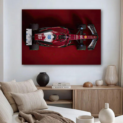 Ferrari F1 2025 Brushed Metal artwork displayed in a modern living room, showcasing its sleek design on a red background.