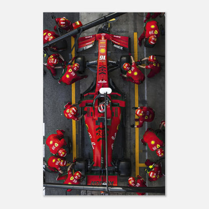 Ferrari pitstop metal print showcasing dynamic racing energy and detailed imagery in vibrant colors.