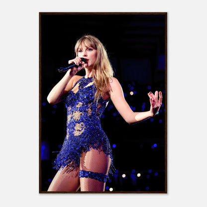 Taylor Swift performance photo in dazzling blue outfit, framed print capturing her vibrant stage energy.