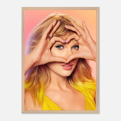 Vintage framed print of Taylor Swift making a heart gesture with her hands, highlighting her charm and style.