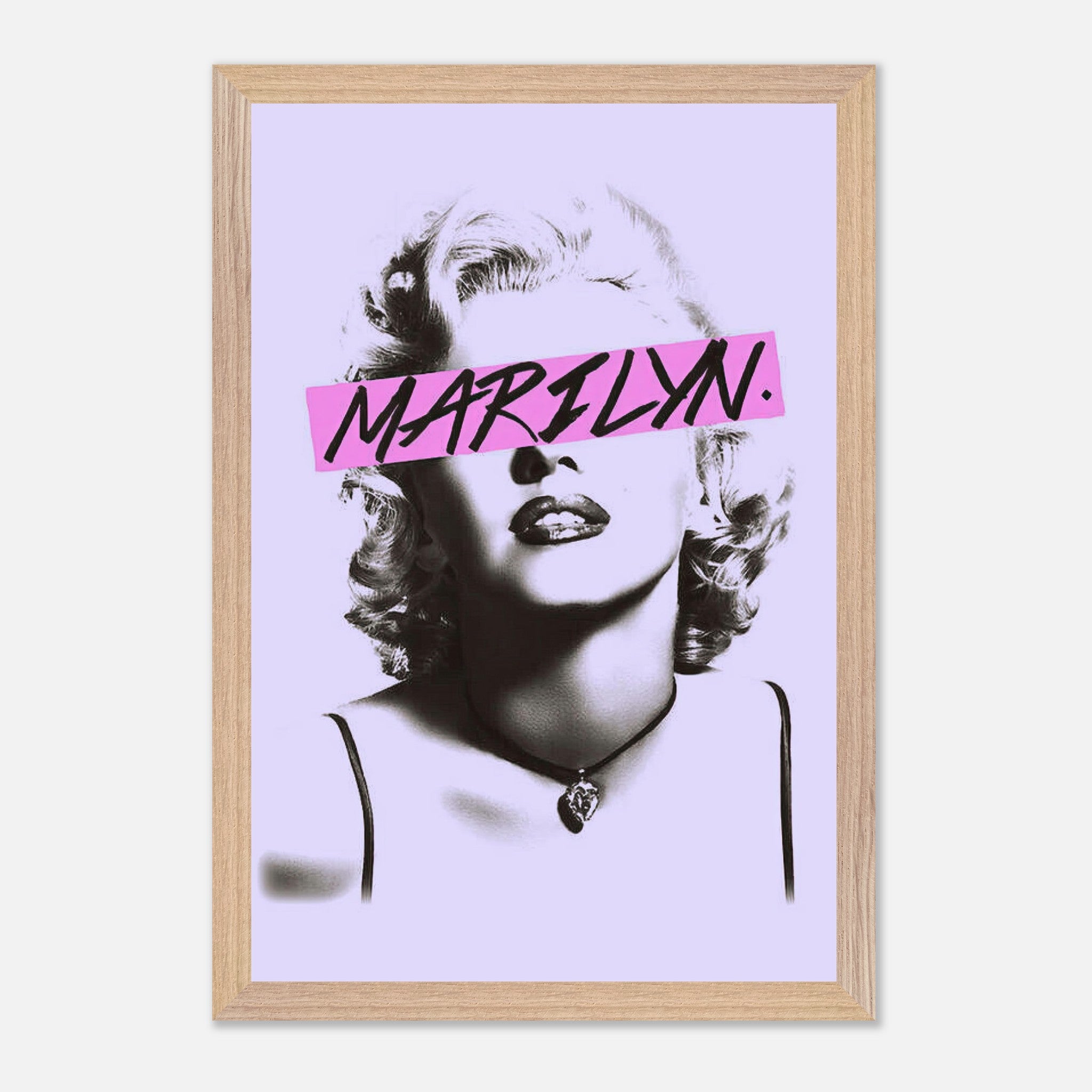 Vintage framed print of Marilyn Monroe with a pink graphic detail, adding modern elegance to any space.