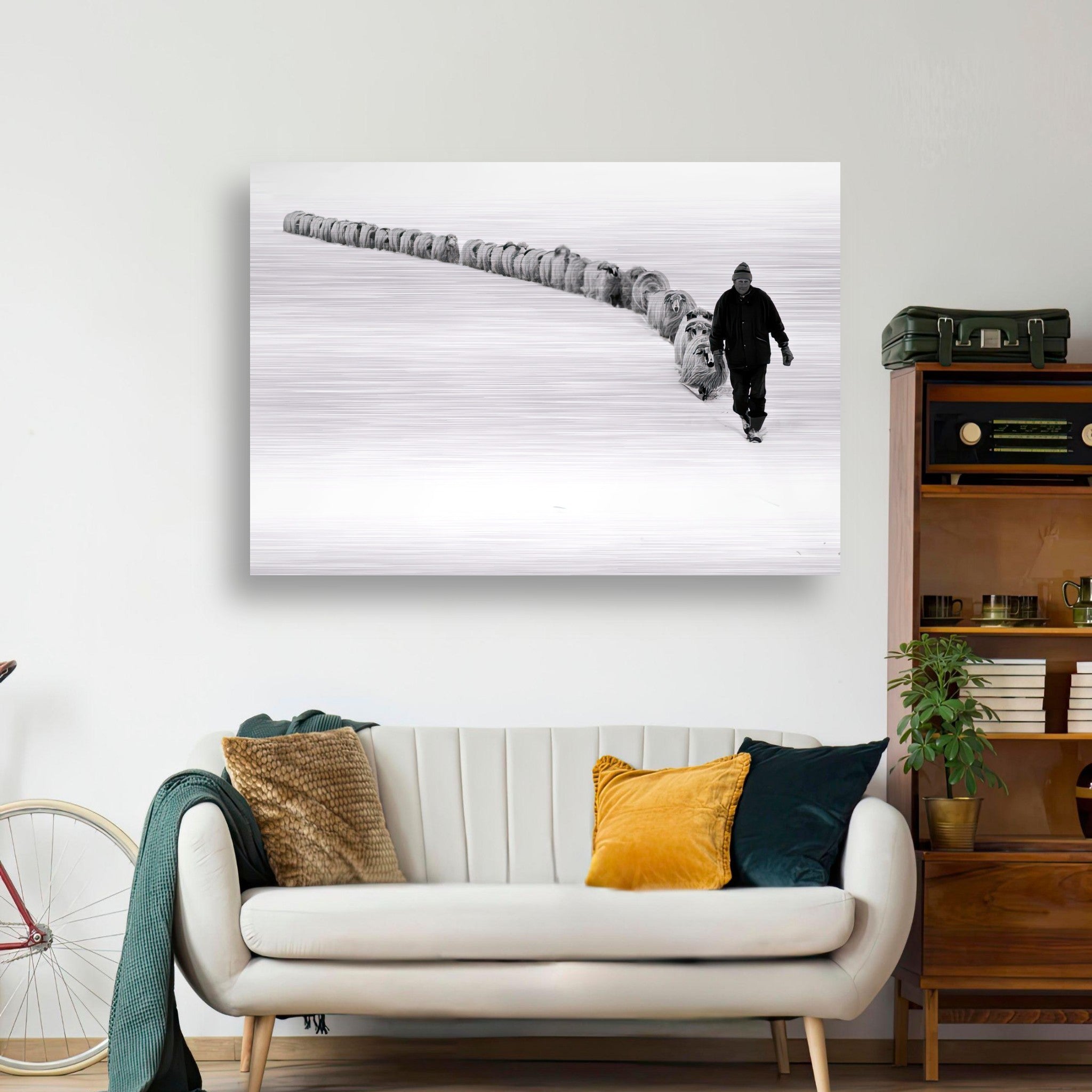 The Shepherd’s Trail Brushed Metal artwork featuring a shepherd guiding a flock in a snowy landscape.