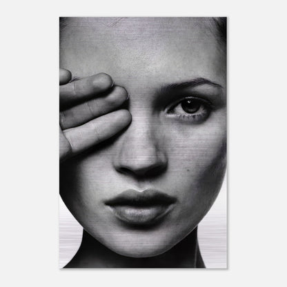 Kate Moss black and white portrait on brushed metal, showcasing her timeless beauty and striking features.