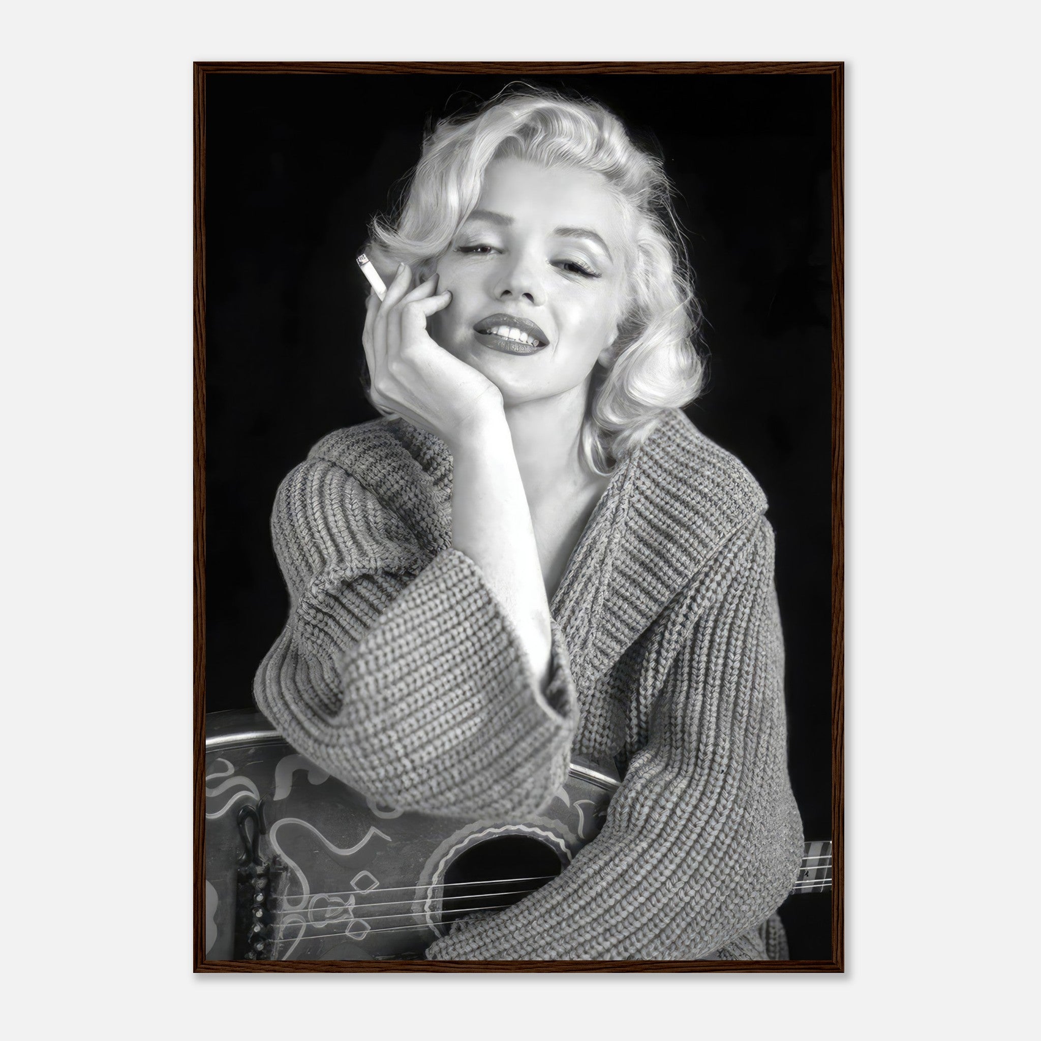 Marilyn Monroe smoking in a cozy knit sweater, captured in a stylish black-and-white framed poster.