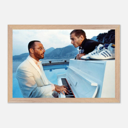 Jean Reno playing piano by poolside with iconic coastal view, inspired by *The Big Blue* film scene, fine art print.