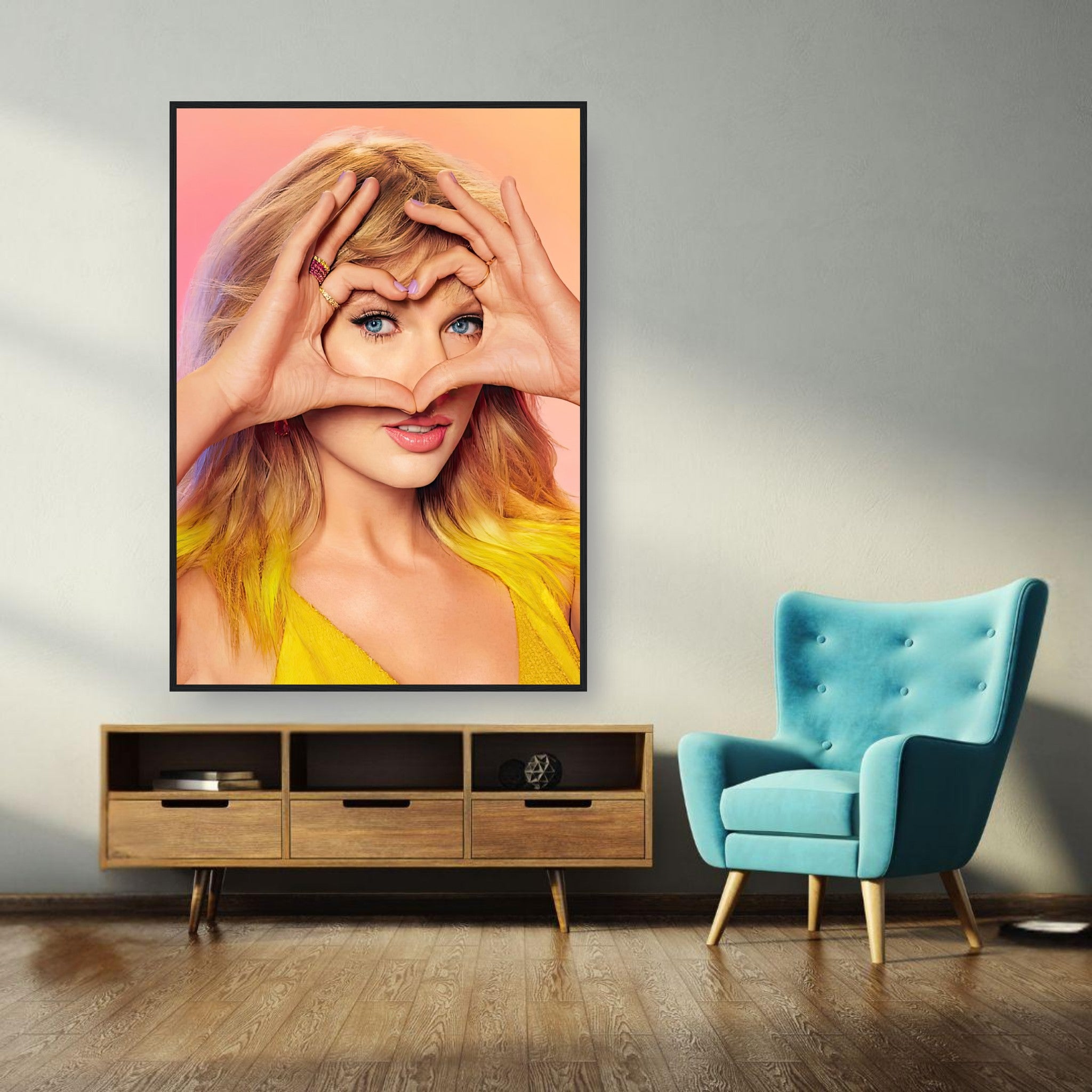 Framed print of Taylor Swift making a heart gesture, showcasing vibrant colors and charm in a stylish room setting.