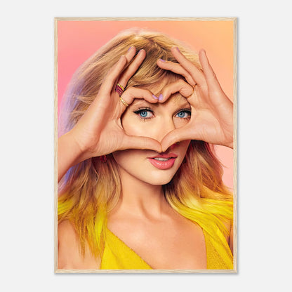 Taylor Swift Fan Love framed print featuring Taylor with heart-shaped hand gesture, vibrant colors and stunning pose.