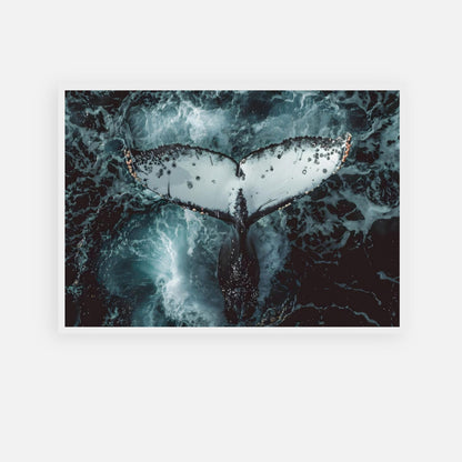 Aerial view of a humpback whale's tail diving underwater in dynamic ocean waves.