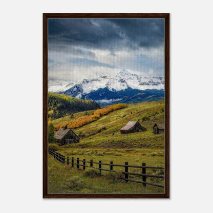 Framed canvas print of Telluride, Colorado featuring snow-capped mountains and rustic barns in a vibrant natural landscape.