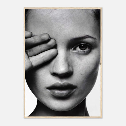 Kate Moss black and white photography framed print showcasing a striking portrait of the model with a hand over her eye.