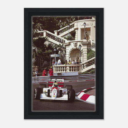 Framed canvas print of Ayrton Senna racing at Monaco, showcasing vibrant colors and iconic motorsport artistry.