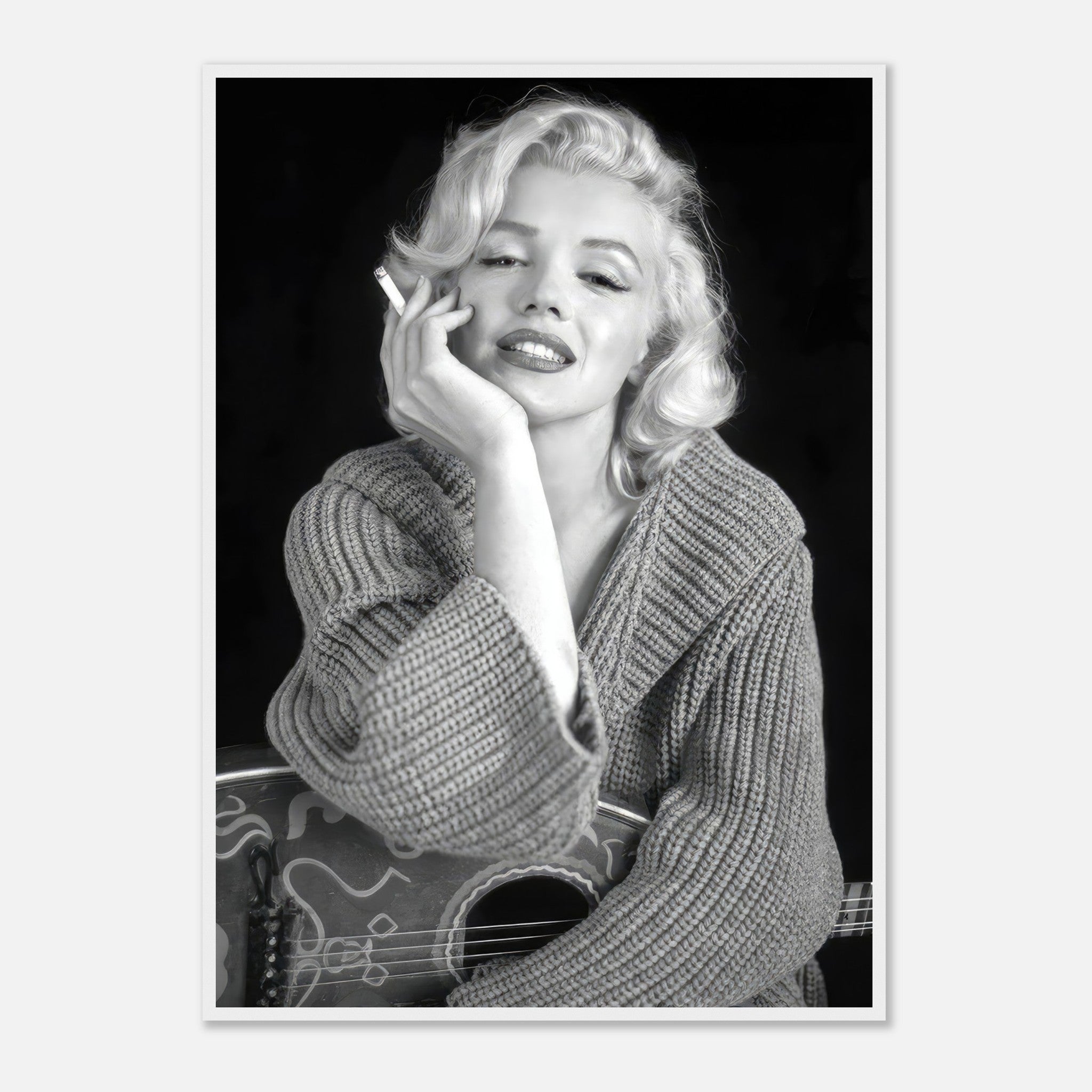 Marilyn Monroe smoking in a cozy sweater, black-and-white framed poster showcasing timeless elegance and Hollywood allure.