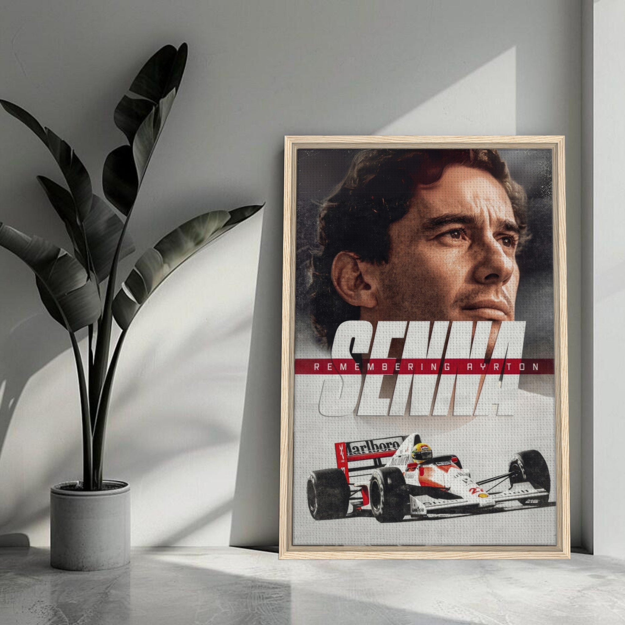 Framed canvas art featuring Ayrton Senna with racing car, celebrating his legacy in Formula 1 motorsport.