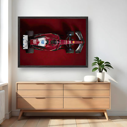 Ferrari F1 2025 Vintage Framed Art showcasing a sleek Formula 1 car on a red background, perfect for motorsport fans.