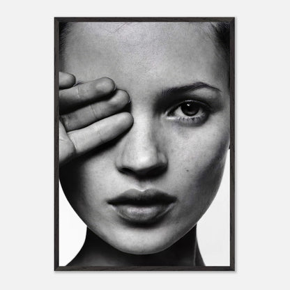 Black and white photography of a woman with one eye visible, framed print showcasing timeless elegance.