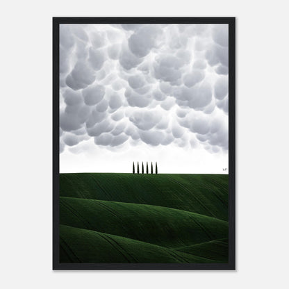 Toscana framed print showcasing rolling green hills and cypress trees under dramatic cloud formations.