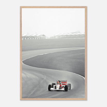 Vintage framed art of Ayrton Senna driving the 1988 McLaren MP4/4 on a racing track.