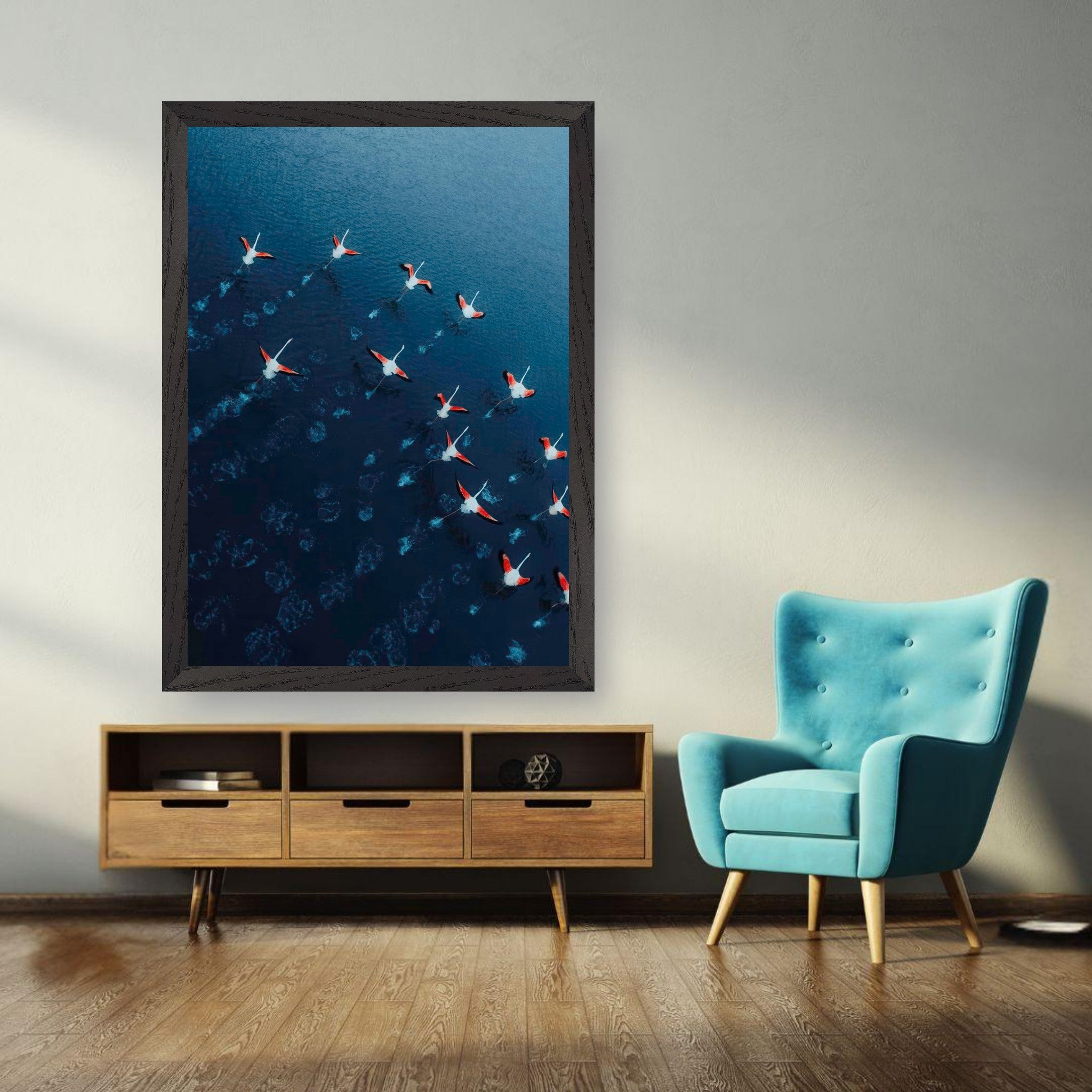 Flamingos drone photography vintage framed print displayed in a modern living room, against a blue background.