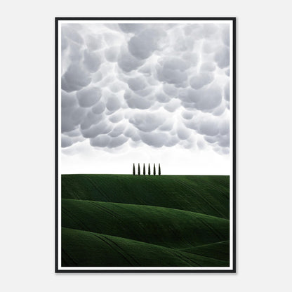 Framed print of Tuscany, Italy featuring rolling green hills and cypress trees under dramatic clouds.