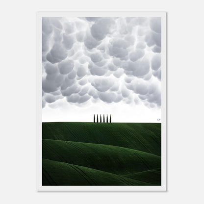 Toscana framed print showcasing rolling green hills and cypress trees under dramatic cloud formations.