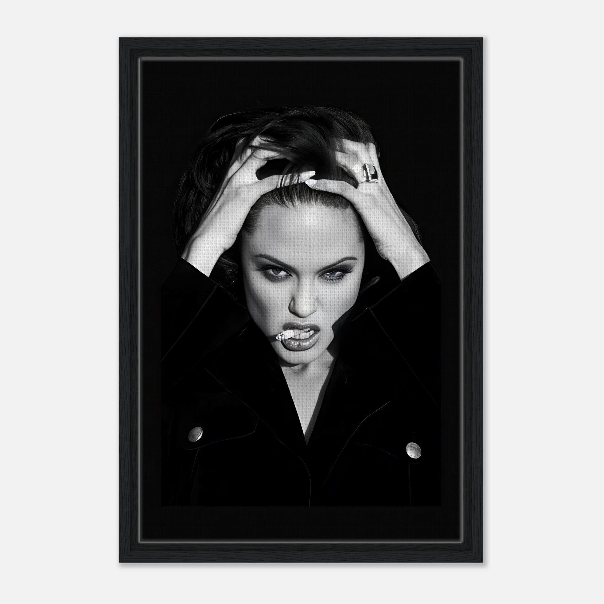 Framed canvas print of Angelina Jolie with a bold expression, showcasing elegance and rebellion in a captivating artwork.