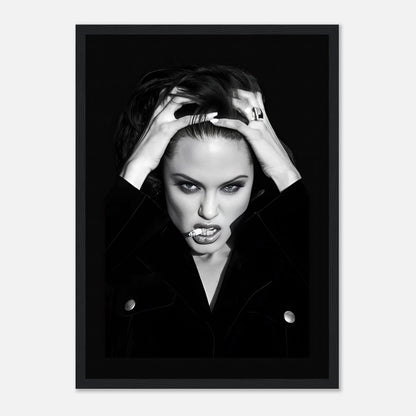 Framed print of Angelina Jolie with dramatic black-and-white contrast showcasing timeless glamour and rebellion.