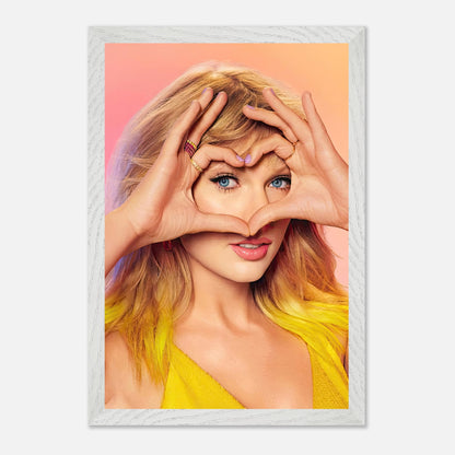 Taylor Swift making a heart shape with her hands, framed print celebrating her love and charm for fans.