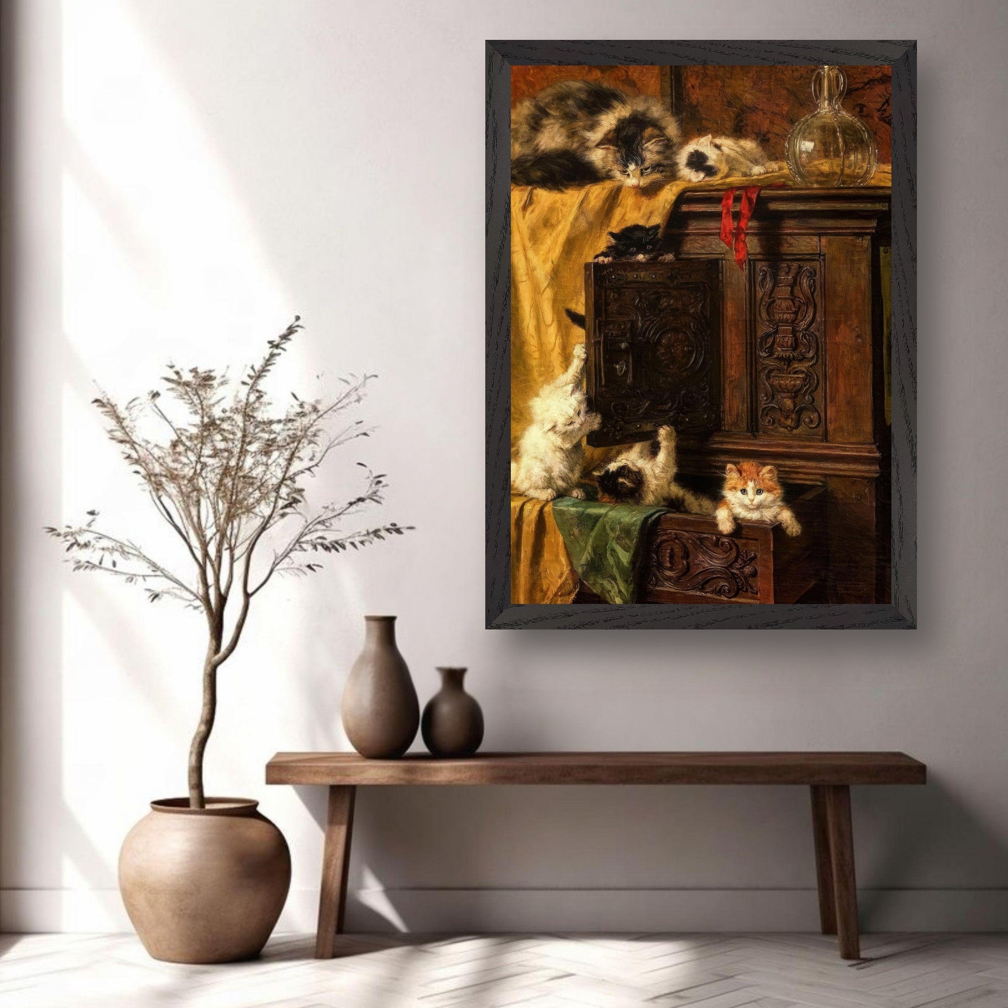 Vintage framed print of playful kittens on a wooden cabinet, bringing charm to home decor.