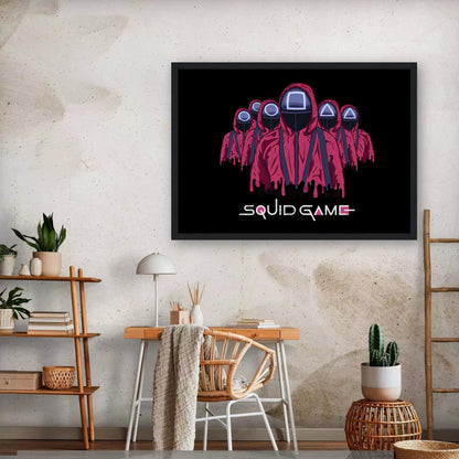 Squid Game Soldiers Framed Poster featuring iconic pink guards with geometric masks in a modern interior setting.