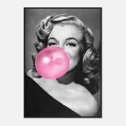 Marilyn Monroe framed print blowing pink bubble gum, adding a touch of quirky glamour to your décor.