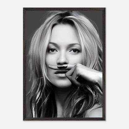 Vintage framed print of Kate Moss with a playful mustache, blending high fashion and humor in a black-and-white design.