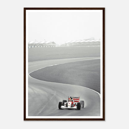 1988 Ayrton Senna McLaren MP4/4 racing on track, black and white framed print showcasing motorsport history.