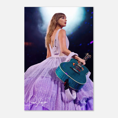 Taylor Swift metal poster in lavender gown holding a guitar, captured live during a stunning performance with vibrant lights.