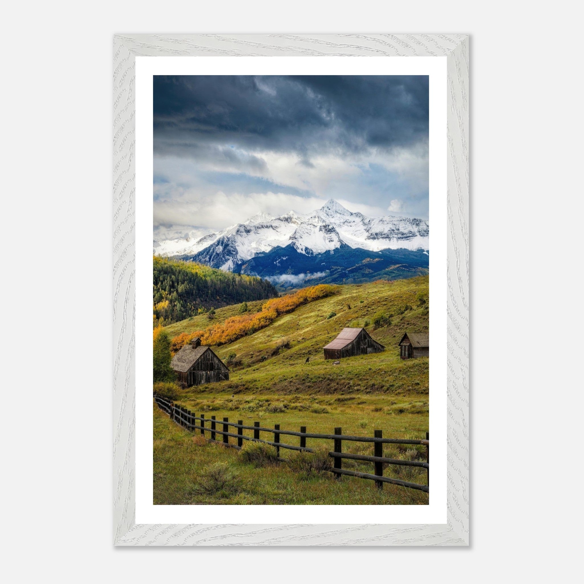 Framed Giclée fine art print depicting Telluride, Colorado with rustic barns and snow-capped mountains.