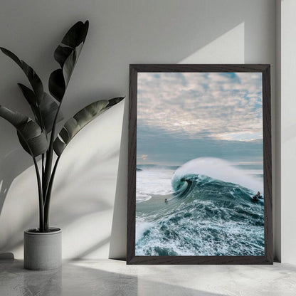 Big Wave Surfing Vintage Framed Print showcasing a surfer riding a massive wave with a dramatic sky.