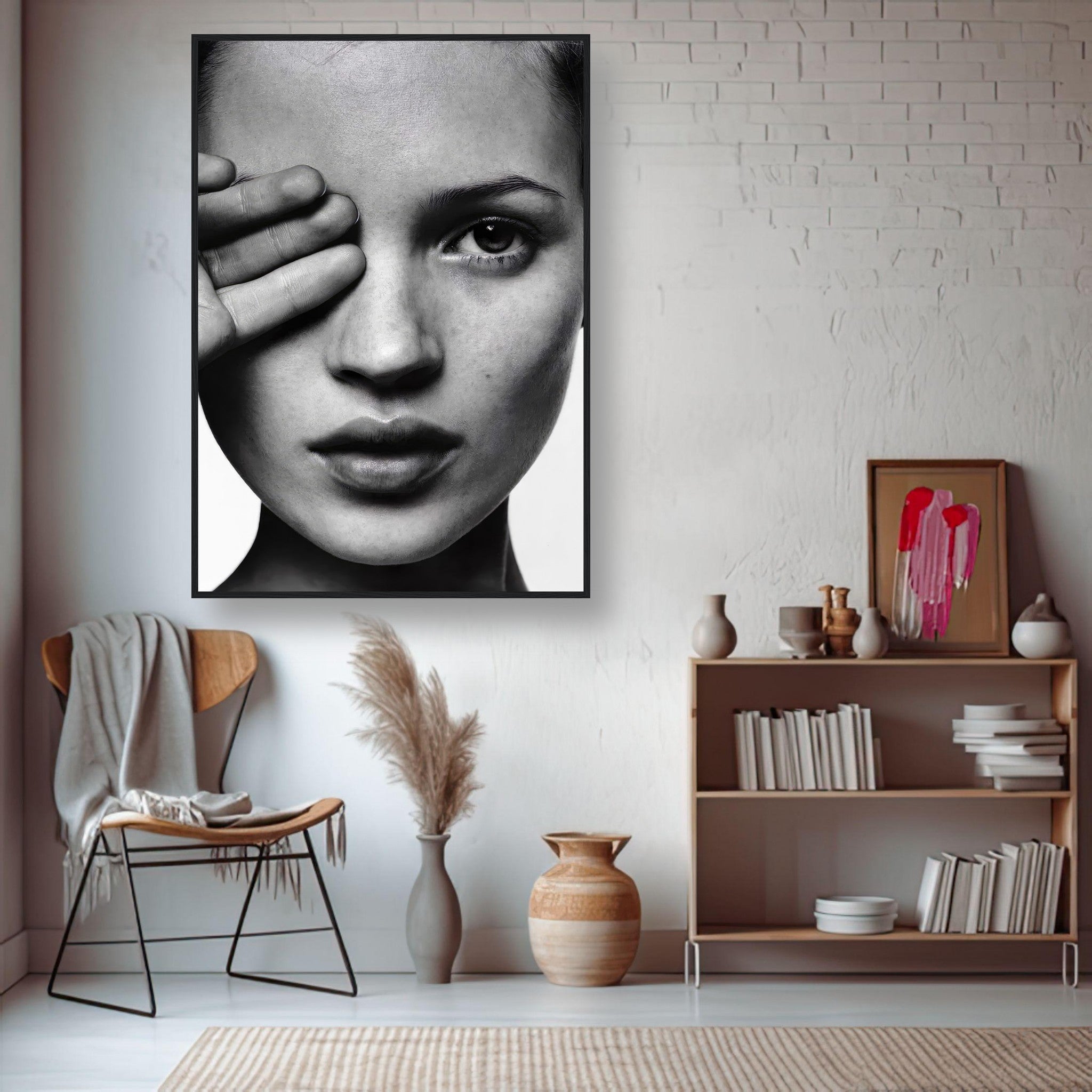 Black and white framed print of a model's face, showcasing elegance and sophistication in modern room décor.