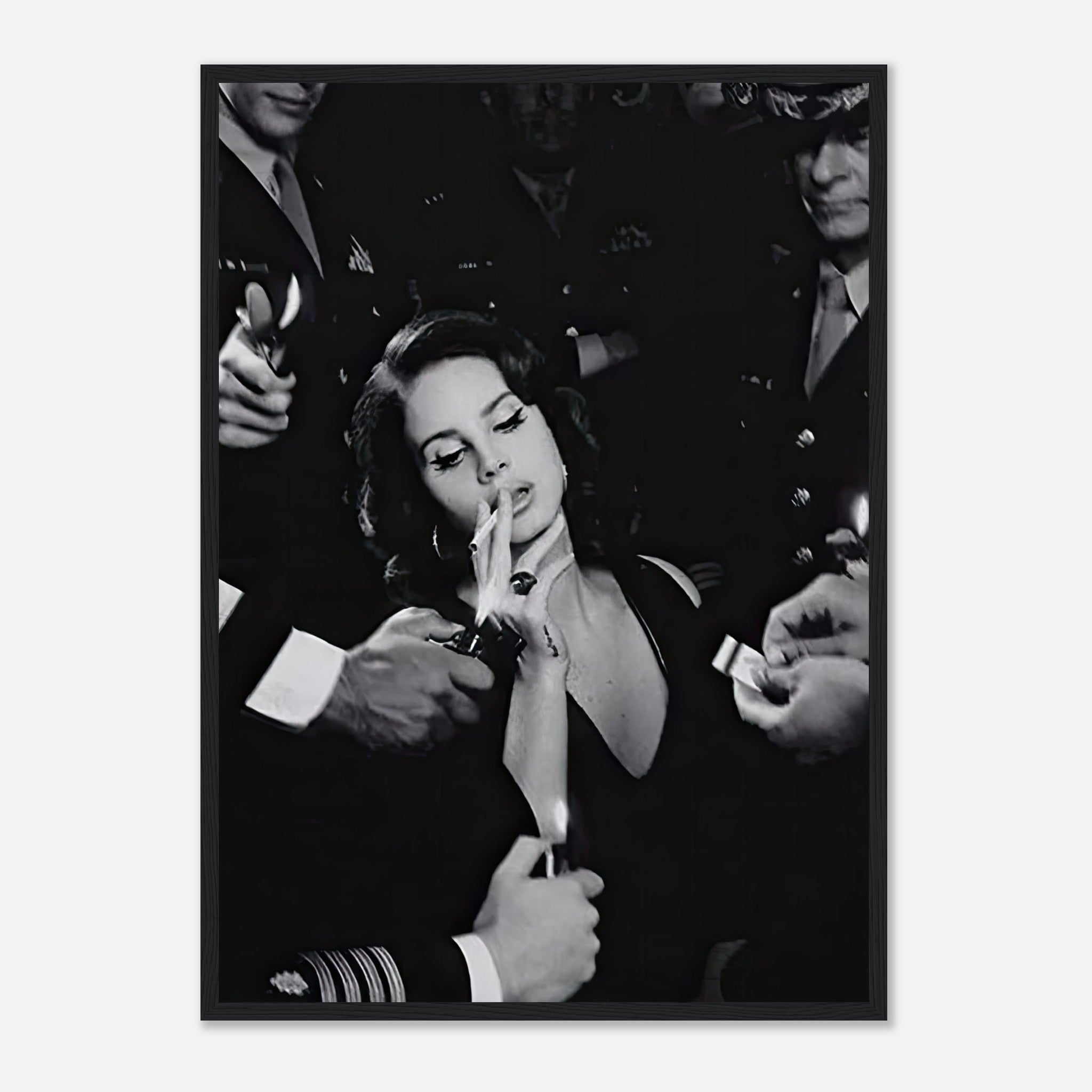 Black-and-white framed print of Lana Del Ray smoking, surrounded by admirers, capturing vintage Hollywood glamour.