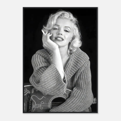 Marilyn Monroe smoking a cigarette while wearing a cozy sweater, captured in a black-and-white framed poster.