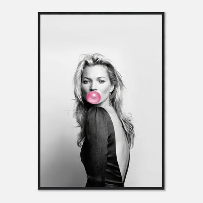 Black-and-white portrait of Kate Moss blowing bubblegum in a stylish outfit, framed for modern decor.